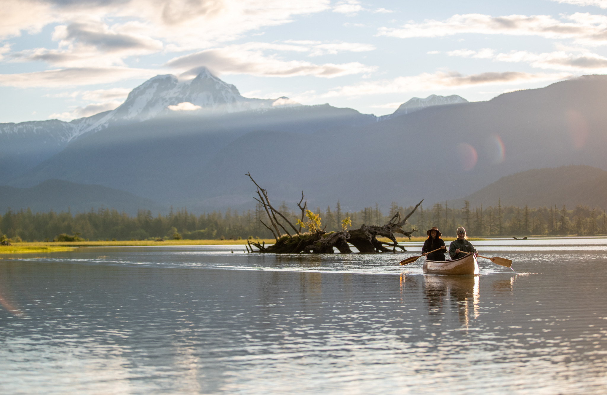 Couple canoeing on Howe Sound with mountain views near Squamish BC