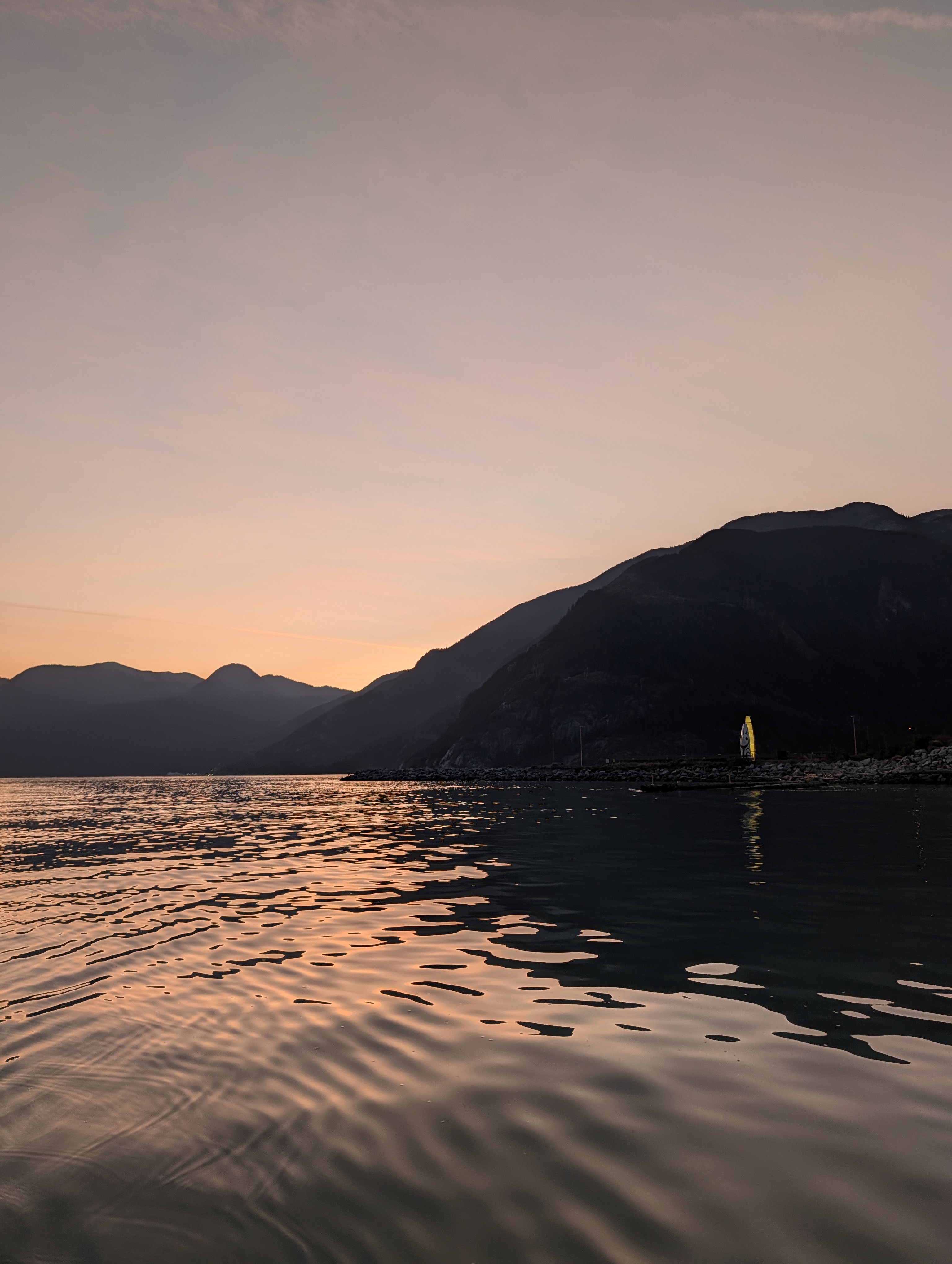 Sunset over Howe Sound with mountain silhouettes near Squamish BC - prime wildlife viewing territory