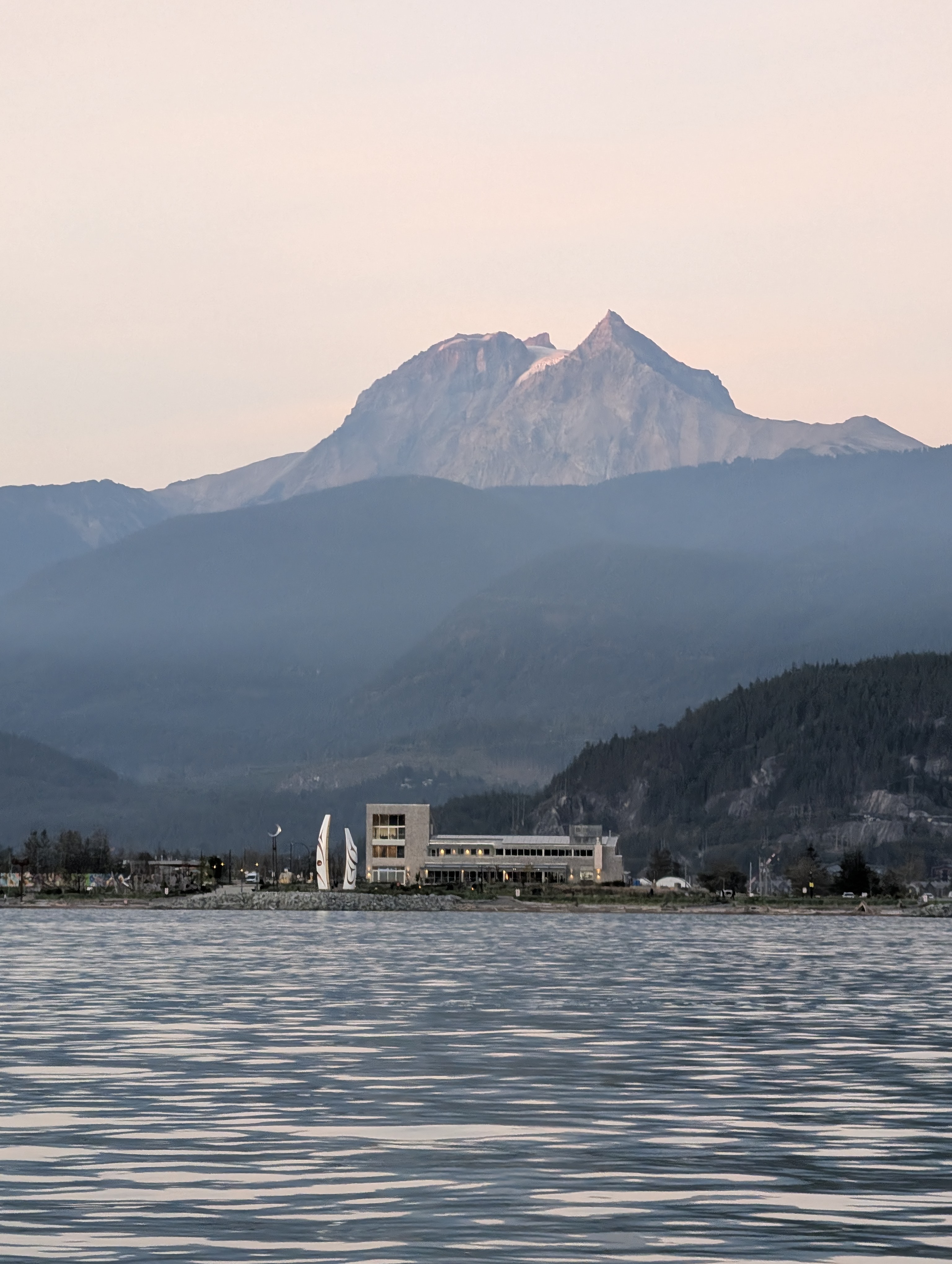 Squamish mountains and Howe Sound fjord seen from a water taxi boat heading to Echo Falls trailhead
